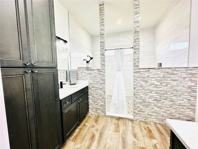 bathroom featuring vanity, a shower with curtain, and hardwood / wood-style flooring