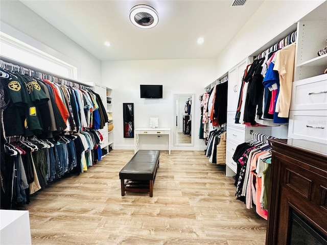 spacious closet featuring light wood-type flooring