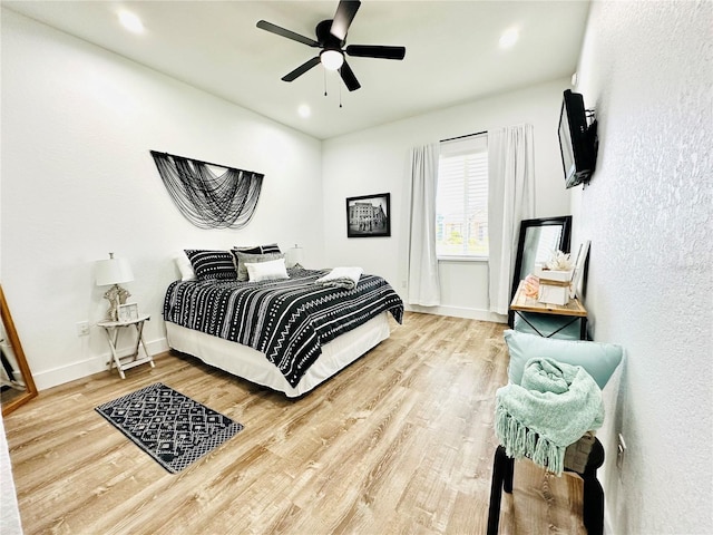 bedroom featuring ceiling fan and hardwood / wood-style floors