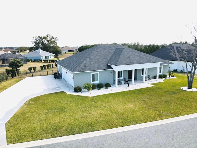 exterior space with a patio and a front yard