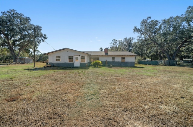 back of house with a yard