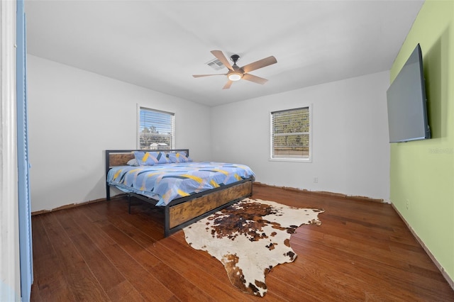 bedroom featuring ceiling fan and dark hardwood / wood-style flooring