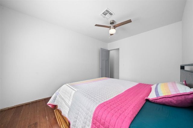 bedroom featuring dark wood-type flooring and ceiling fan