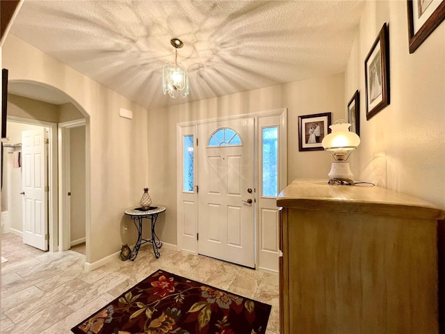 entrance foyer featuring a textured ceiling