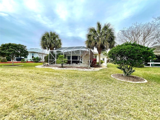 exterior space with glass enclosure and a front lawn