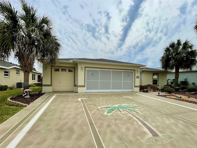 view of front facade featuring a garage and cooling unit