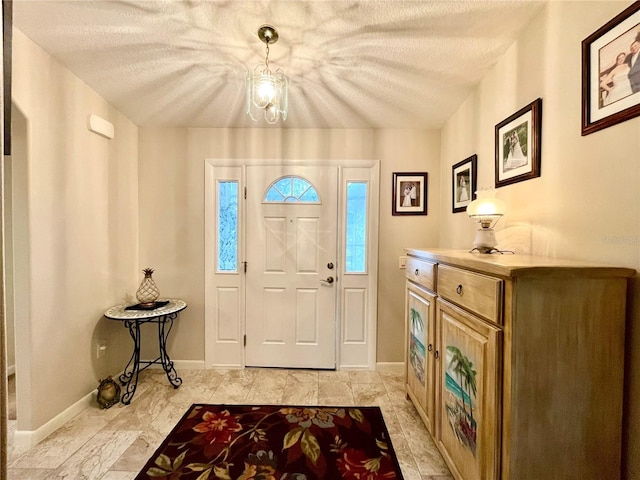 entryway with a textured ceiling