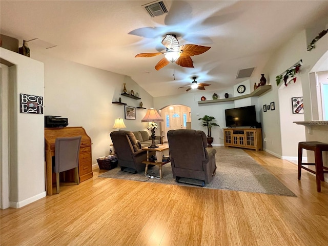 living room featuring lofted ceiling, ceiling fan, and light hardwood / wood-style flooring