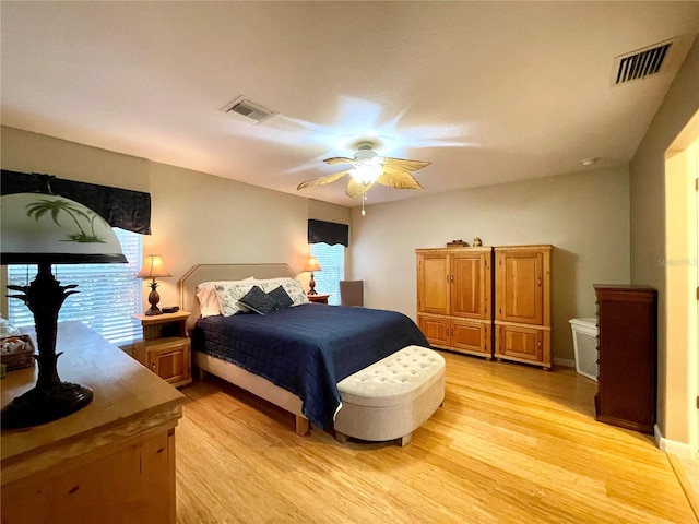 bedroom with ceiling fan and light wood-type flooring