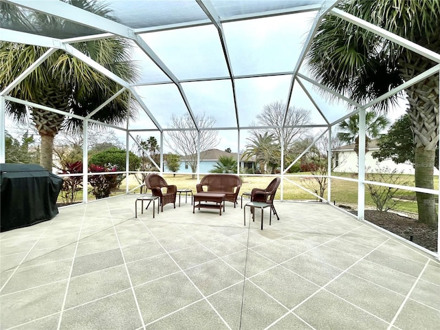 view of patio / terrace featuring area for grilling and glass enclosure