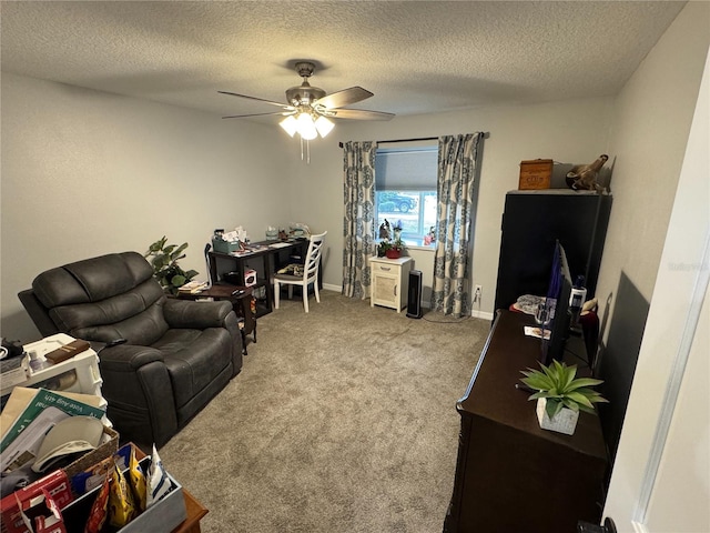 carpeted living room with ceiling fan and a textured ceiling