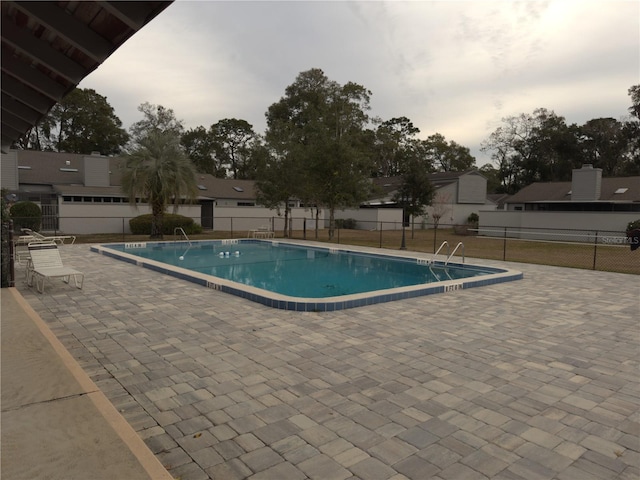 view of swimming pool featuring a patio area