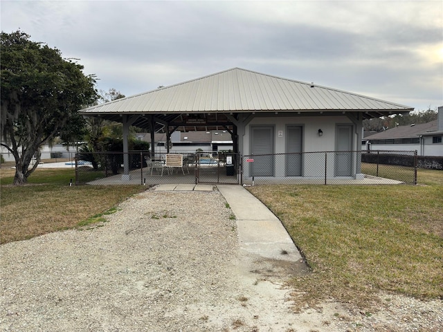 exterior space featuring a lawn and a gazebo