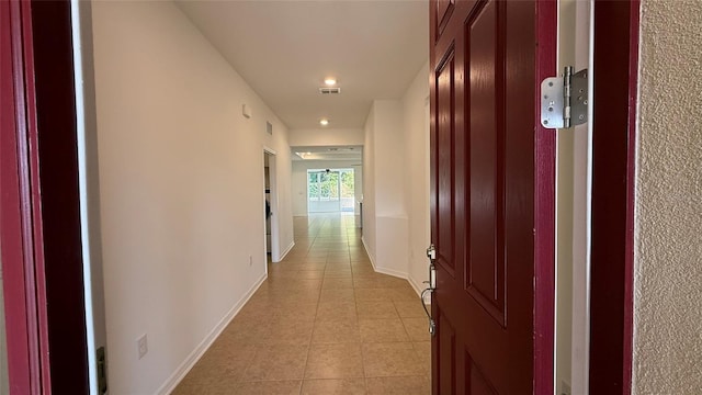 hallway with light tile patterned floors