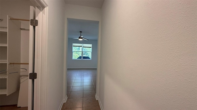 hall featuring tile patterned flooring