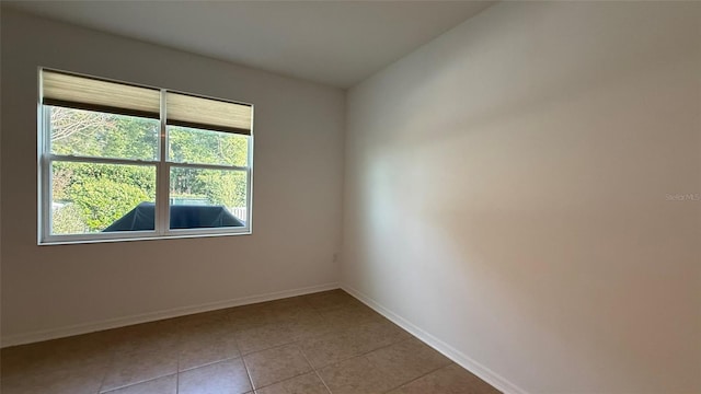 spare room with tile patterned floors