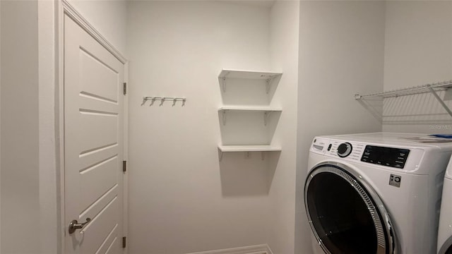 washroom with separate washer and dryer