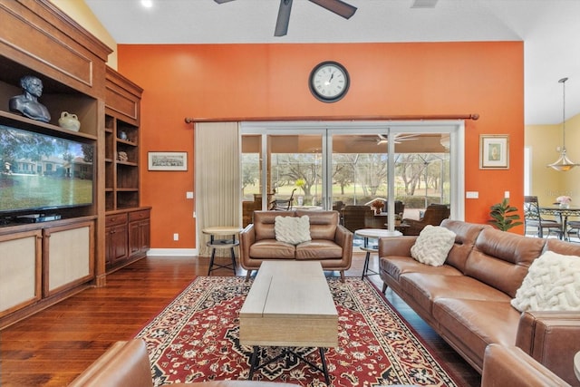 living room with dark wood-type flooring and ceiling fan