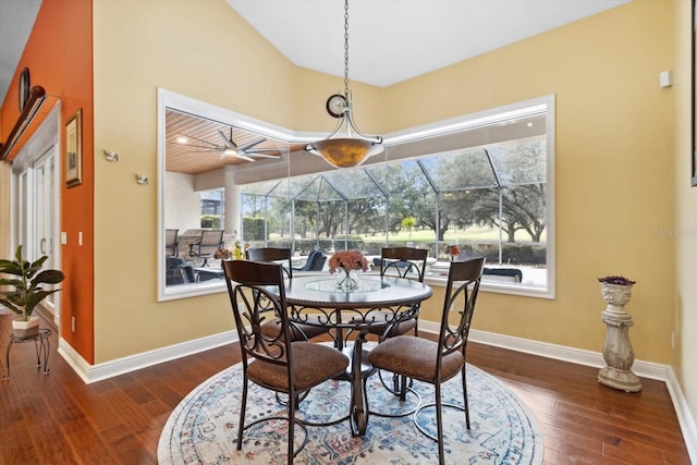 dining area featuring ceiling fan and dark hardwood / wood-style floors