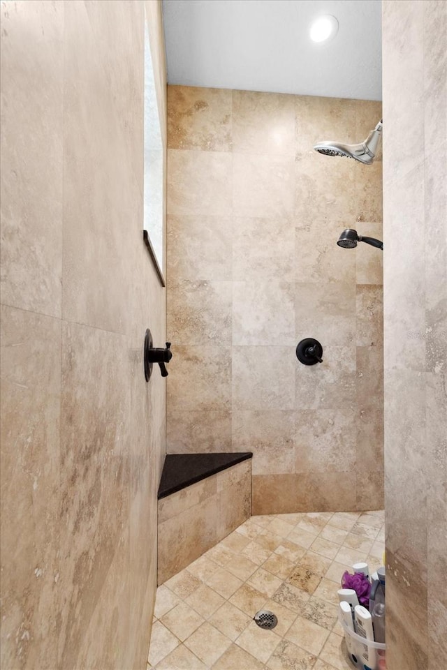 bathroom with tiled shower