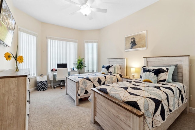 bedroom featuring light colored carpet and ceiling fan