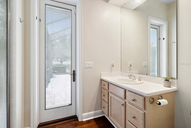 bathroom featuring vanity and hardwood / wood-style floors