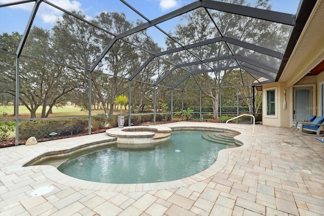 view of pool with a lanai, a patio, and an in ground hot tub