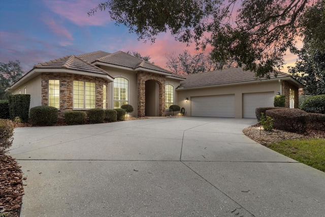 ranch-style home featuring a garage