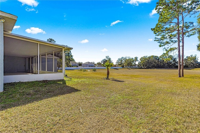 view of yard with a sunroom