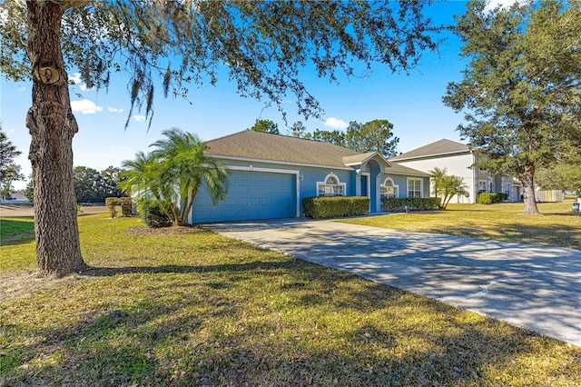 ranch-style home with a garage and a front yard