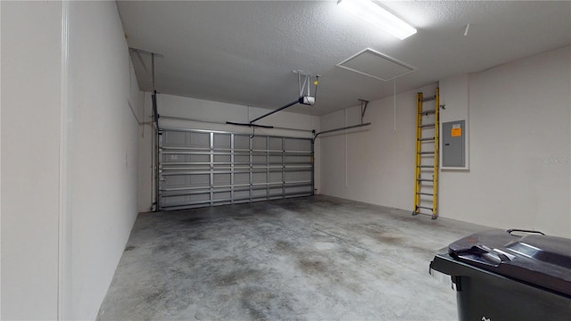 garage featuring a garage door opener and electric panel