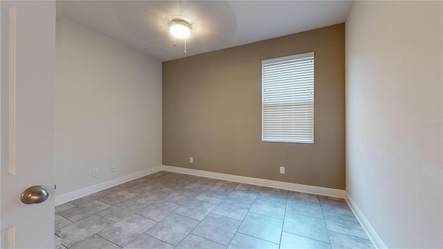 unfurnished room featuring light tile patterned flooring