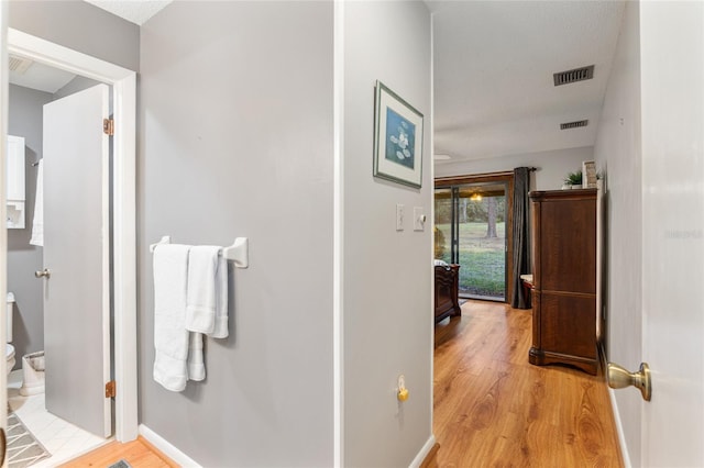 hallway featuring light wood-type flooring