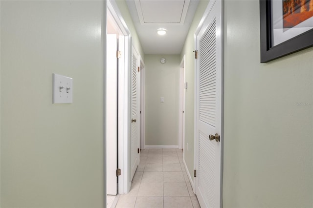 corridor with light tile patterned floors