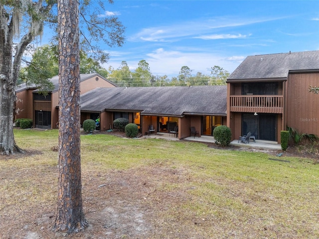 exterior space with a front lawn and a patio area