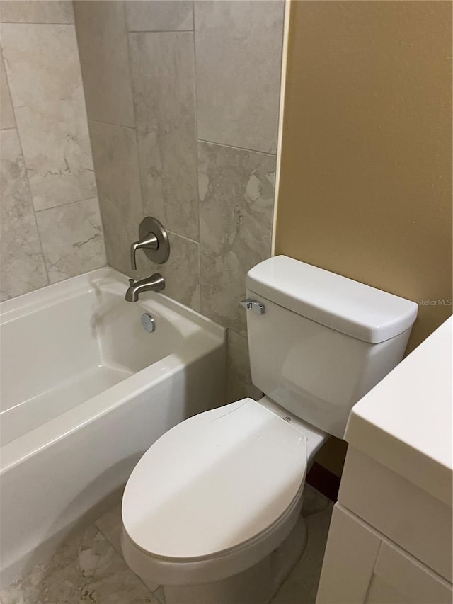 full bathroom with toilet, tiled shower / bath, and vanity