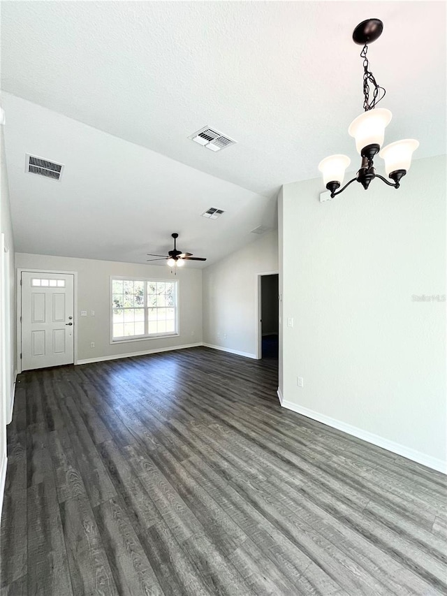 unfurnished living room featuring ceiling fan with notable chandelier, dark wood-type flooring, and lofted ceiling