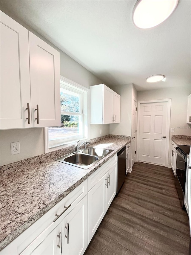 kitchen featuring white cabinets, appliances with stainless steel finishes, sink, and dark hardwood / wood-style flooring