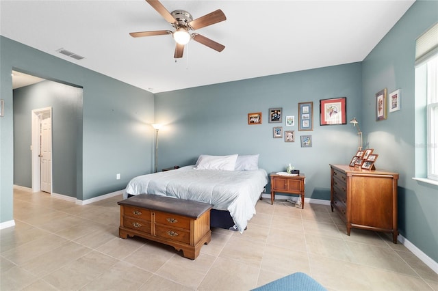 bedroom with light tile patterned flooring and ceiling fan