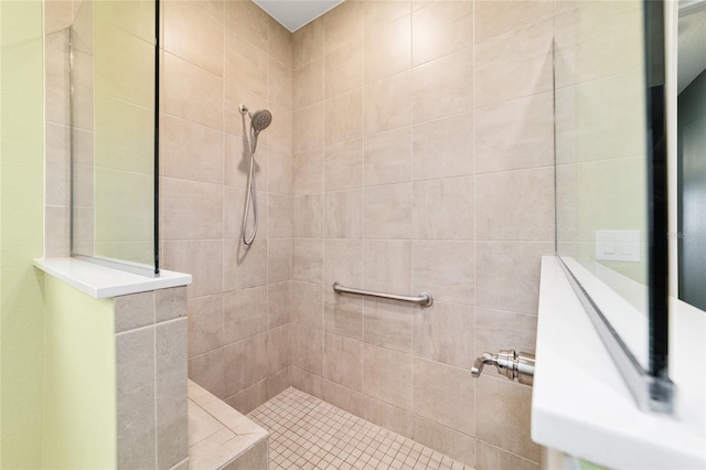 bathroom with tiled shower