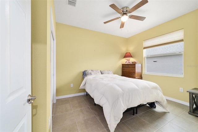 bedroom featuring ceiling fan and light tile patterned floors