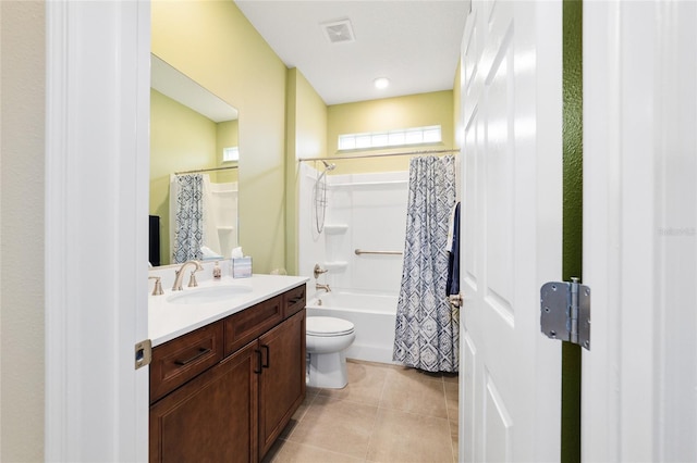 full bathroom featuring shower / bath combo with shower curtain, toilet, vanity, and tile patterned flooring