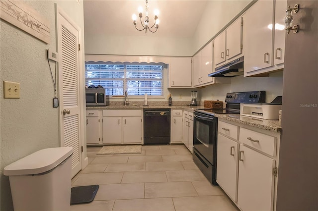 kitchen with black appliances, white cabinetry, a chandelier, light tile patterned floors, and decorative light fixtures