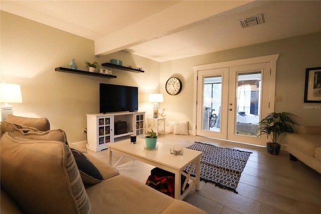 living room featuring french doors and beamed ceiling