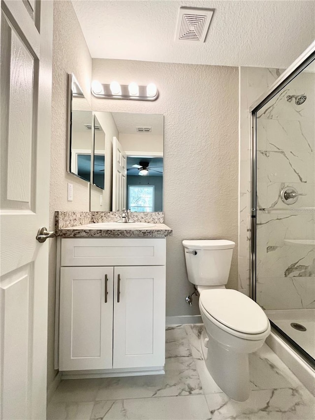 bathroom with a textured ceiling, walk in shower, vanity, and toilet