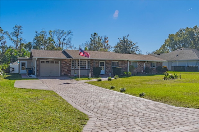 ranch-style home with a garage and a front yard