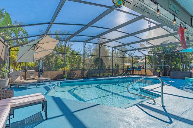 view of pool featuring a lanai and a patio