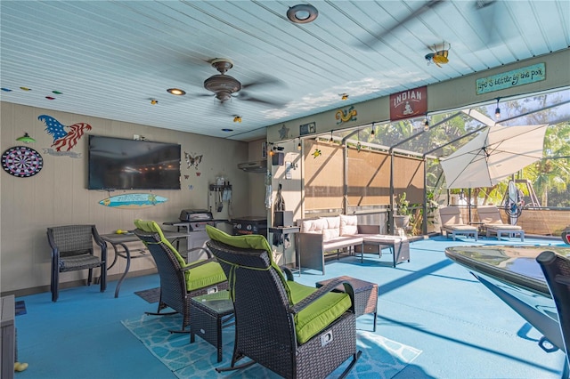 view of patio with ceiling fan, a lanai, and an outdoor hangout area