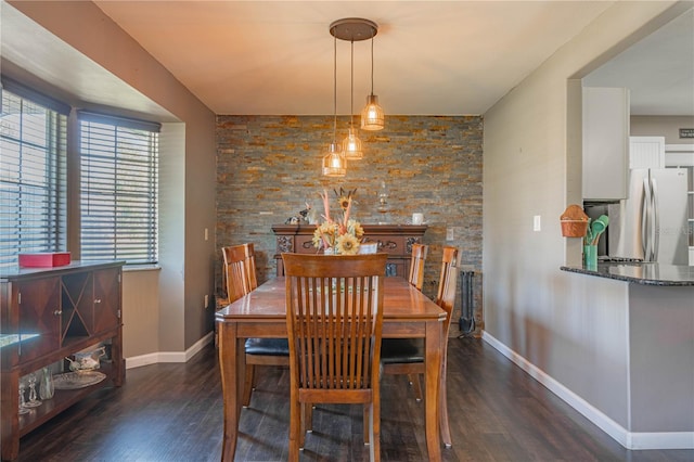 dining room with dark hardwood / wood-style flooring