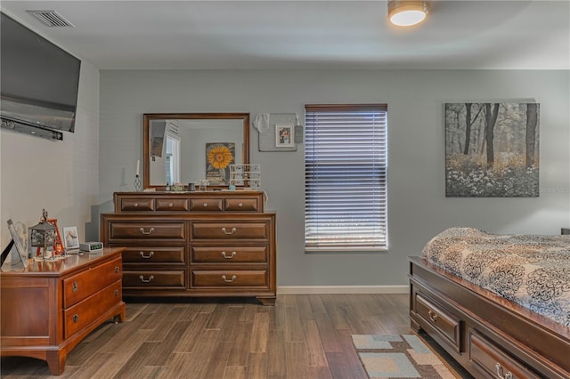 bedroom featuring dark wood-type flooring